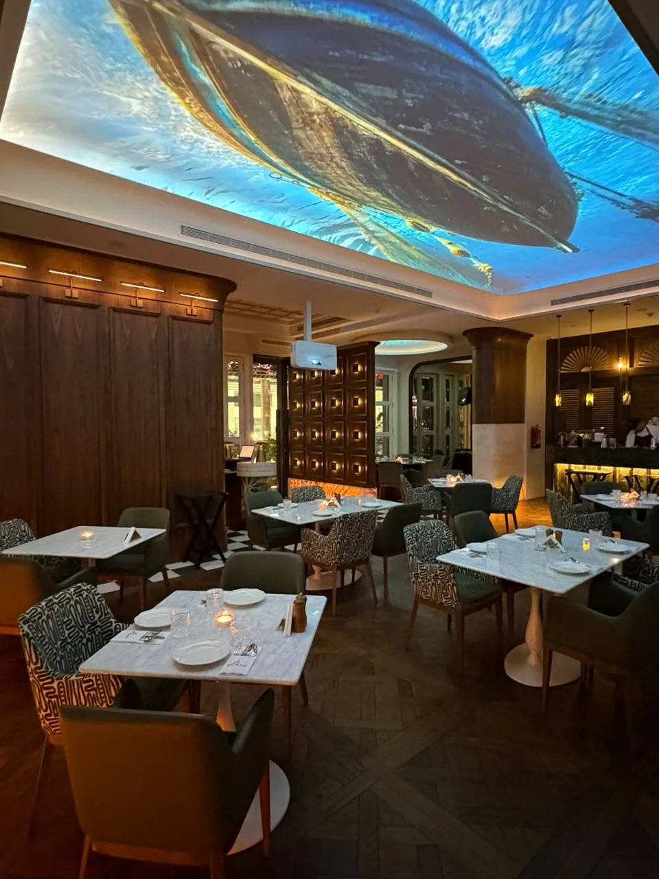 OLEV dining room, warmly illuminated for an evening visit